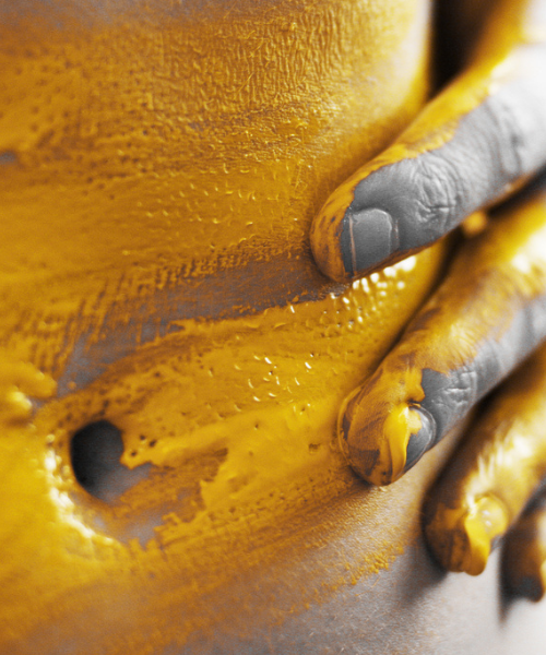 close up of stomach with yellow paint