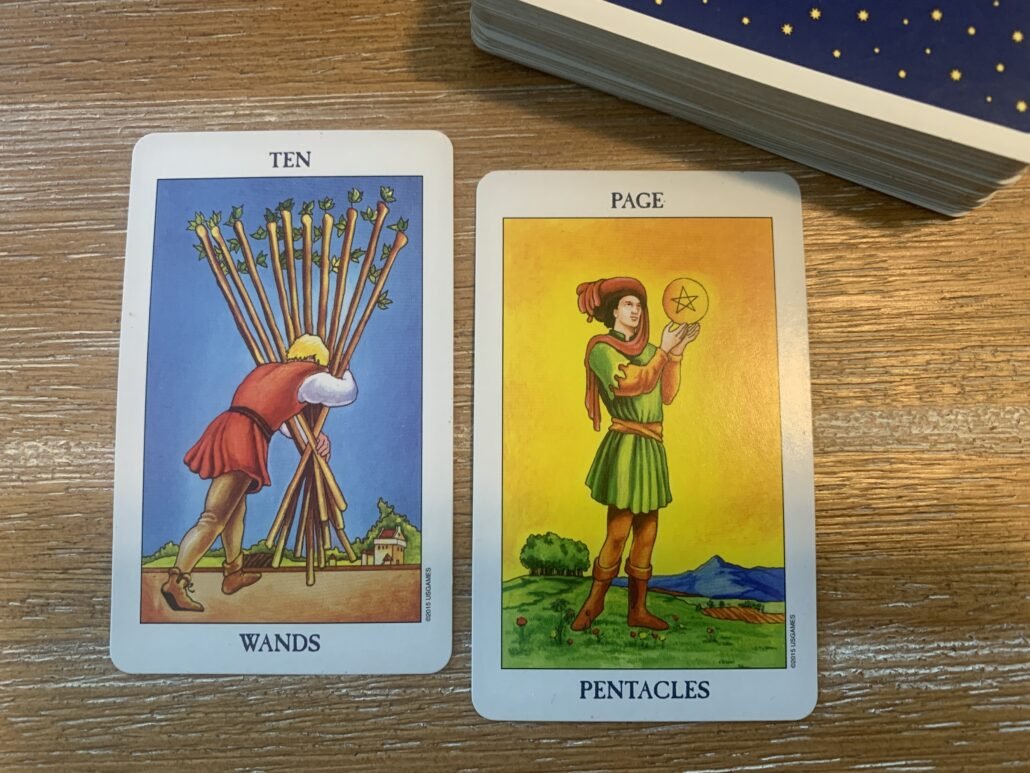 10 of wands and page of pentacles tarot cards